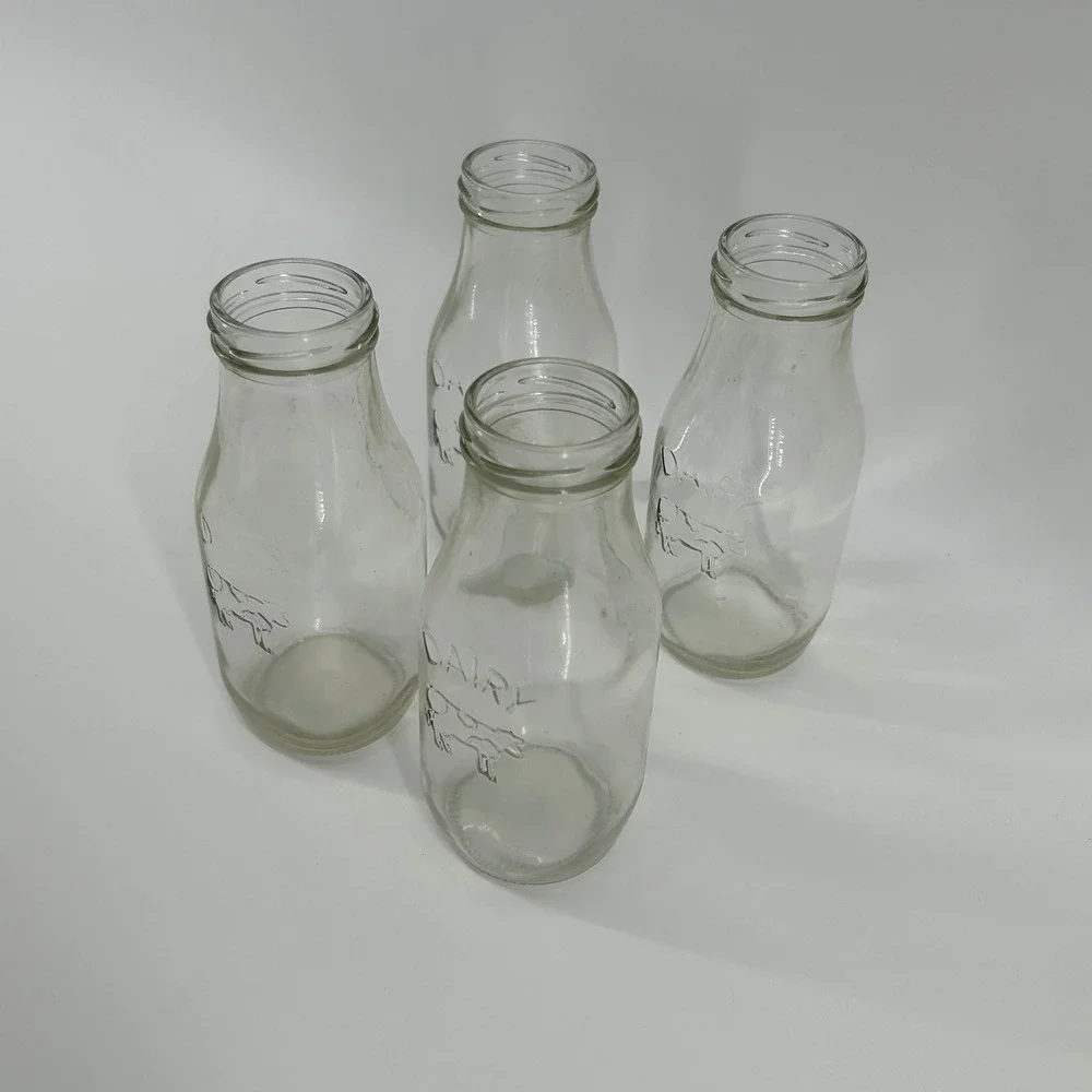 Set of 4 Vintage Style Glass Milk Bottles Embossed Cow Dairy Farmhouse Decor